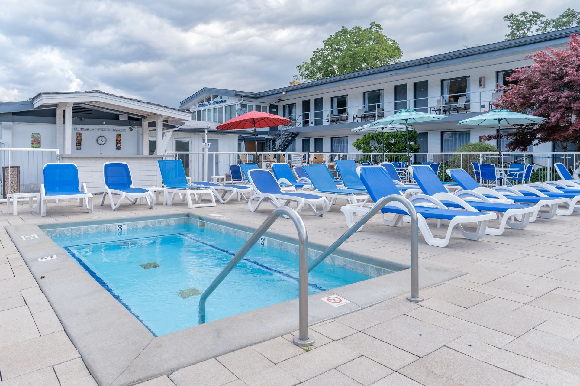 Ship-n-Shore Hotel pool with blue lounge chairs